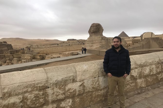 4 Hour Giza Pyramids & Sphinx Tour - Stop 2: The Great Sphinx, photo help plus the story behind the statue