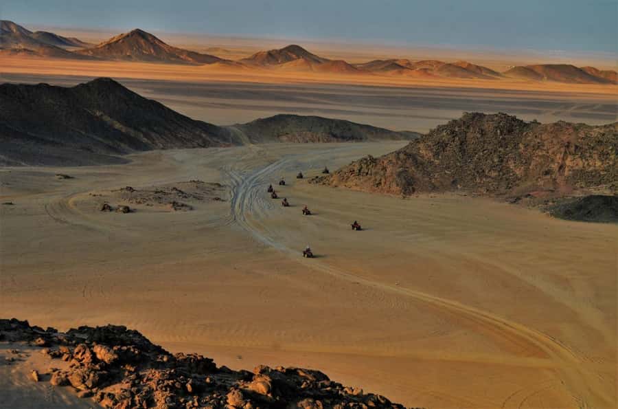 Hurghada: Red Sea Desert Quad Biking Tour & Sand Mountain - Reaching the sand mountain, the climb that turns it into a story