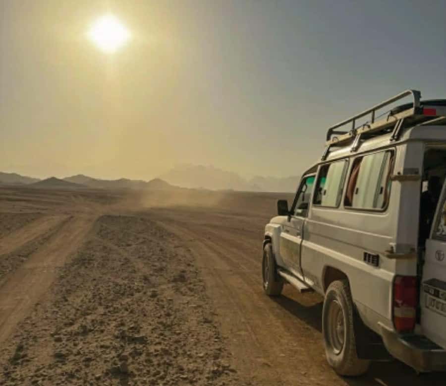 Hurghada: Safari Jeep & Camel Ride with BBQ Dinner & Show - Hurghada pickup and the quick handoff to the desert