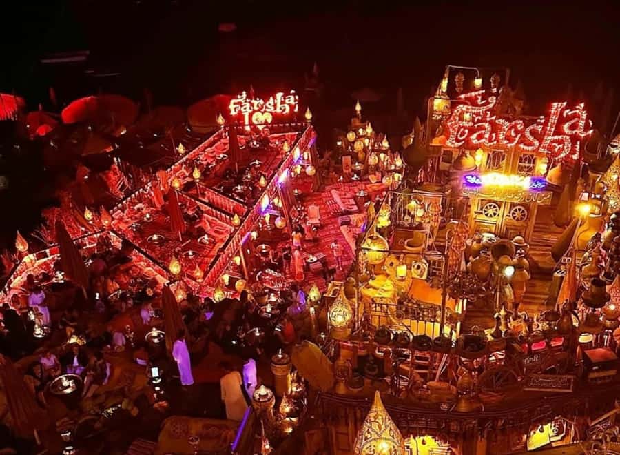 Sharm el Sheikh: Farsha Cafe & Soho Square Night Out Driver - Soho Square at night: entertainment choices, shopping, and the cold break option
