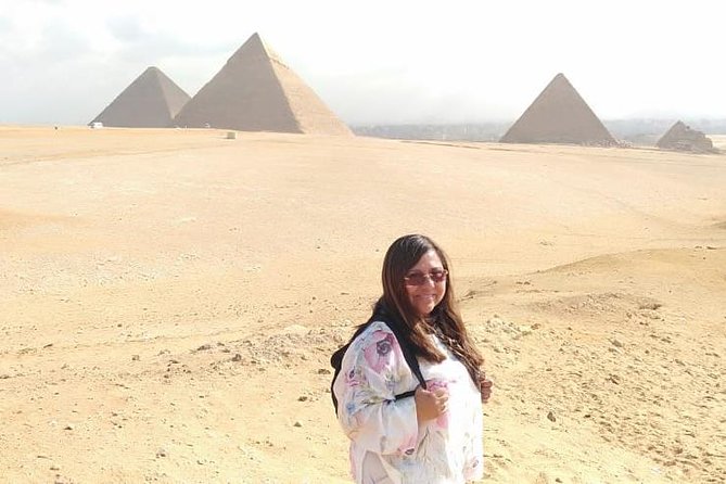 Top rated Giza Pyramids and Sphinx Tour from Cairo Airport - Egyptologist guide plus private group feel: how guides like Zenab and Mahmoud shape the day